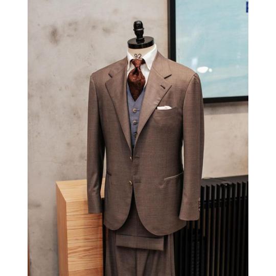 Brwon suit and light blue waistcoat