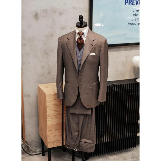Brwon suit and light blue waistcoat