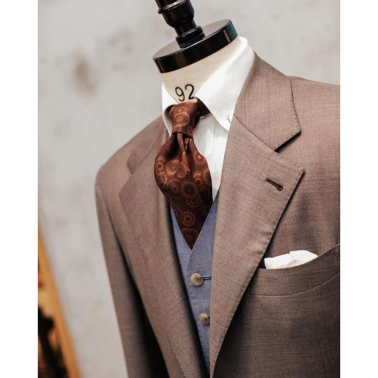 Brwon suit and light blue waistcoat