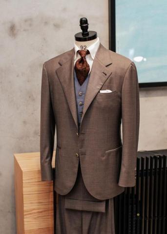 Brwon suit and light blue waistcoat